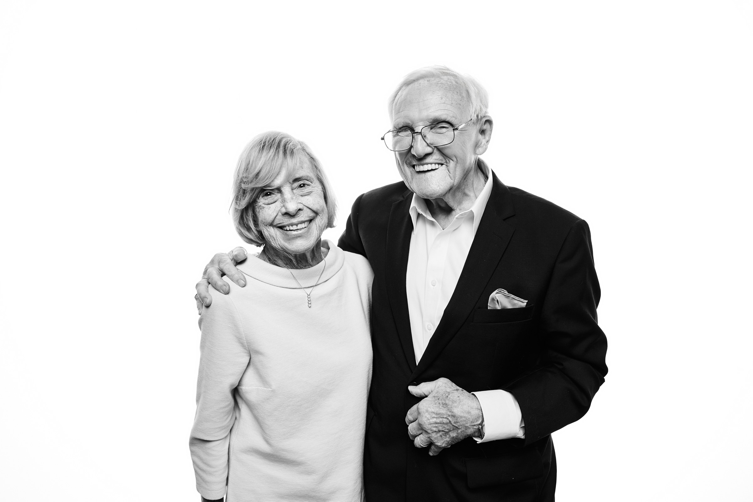 An elderly couple smiling arm in arm, a portrait to keep for a lifetime
